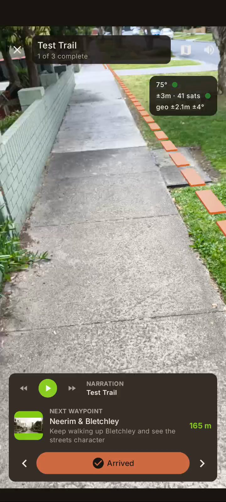 AR view on Android: a dashed clay-coloured line running along a footpath beside a fence.